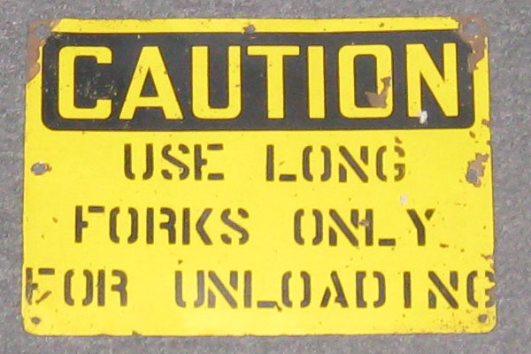 Sign-Caution use long forks only for unloading, stock number S-0107