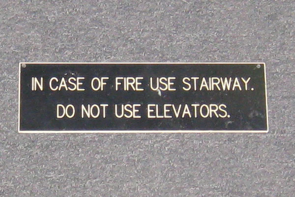 Sign-In Case of Fire Use Stairway Do Not Use Elevator, stock number S-0388