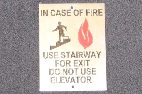 Sign-In Case Of Fire Use Stairway For Exit Do Not Use Elevator, stock number S-0634