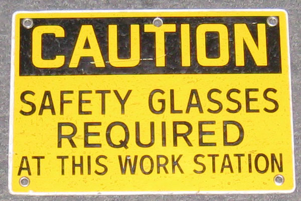 Sign-Caution Safety Glasses Required At This Work Station, stock number S-0771