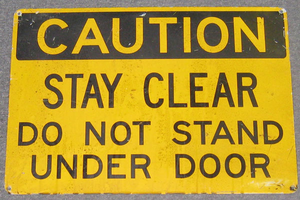 Sign-Caution Stay Clear Do Not Stand Under Door, stock number S-1538