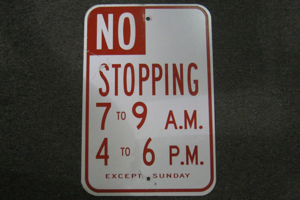 Sign-No stopping 7 to 9am/ 4 to 6pm except Sunday, stock number S-1648