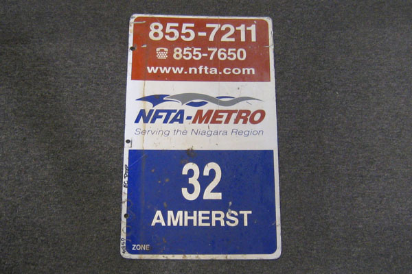 Sign-NFTA Metro Serving The Niagara Region 32 Amherst. 12x21 metal red/wht /blu, stock number S-1650
