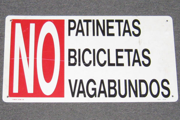 Sign-Spanish-No Patinetas Bicicletas Vagabundos, stock number S-2059