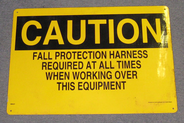 Sign-Caution - Fall protection harness required at all times when working over, stock number S-2353
