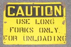 Sign-Caution use long forks only for unloading, stock number S-0107