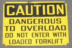Sign-Caution dangerous to over load - do not enter with loaded, stock number S-0134