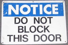 Sign-Notice Do Not Block This Door, stock number S-0248
