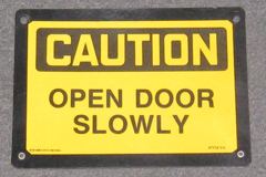 Sign-Caution open door slowly, stock number S-0287