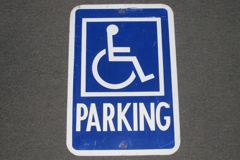Sign-PARKING w/ symbol of disabled person, stock number S-0516