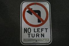Sign-No Left Turn - w/ international symbol for no left turn, stock number S-0605