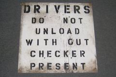Sign-Drivers Do Not Unload Without Checker Present, stock number S-0760