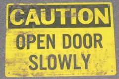 Sign-Caution Open Door Slowly, stock number S-0783