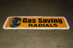 Sign-Gas Saving Radials w/ picture of tire on wheel, stock number S-1073