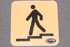 Sign-symbol of man walking downstairs, stock number S-1243