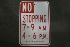 Sign-No stopping 7 to 9am/ 4 to 6pm except Sunday, stock number S-1648