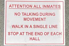 Sign - Attention All Inmates No Talking During Movement Walk In A, stock number S-2940
